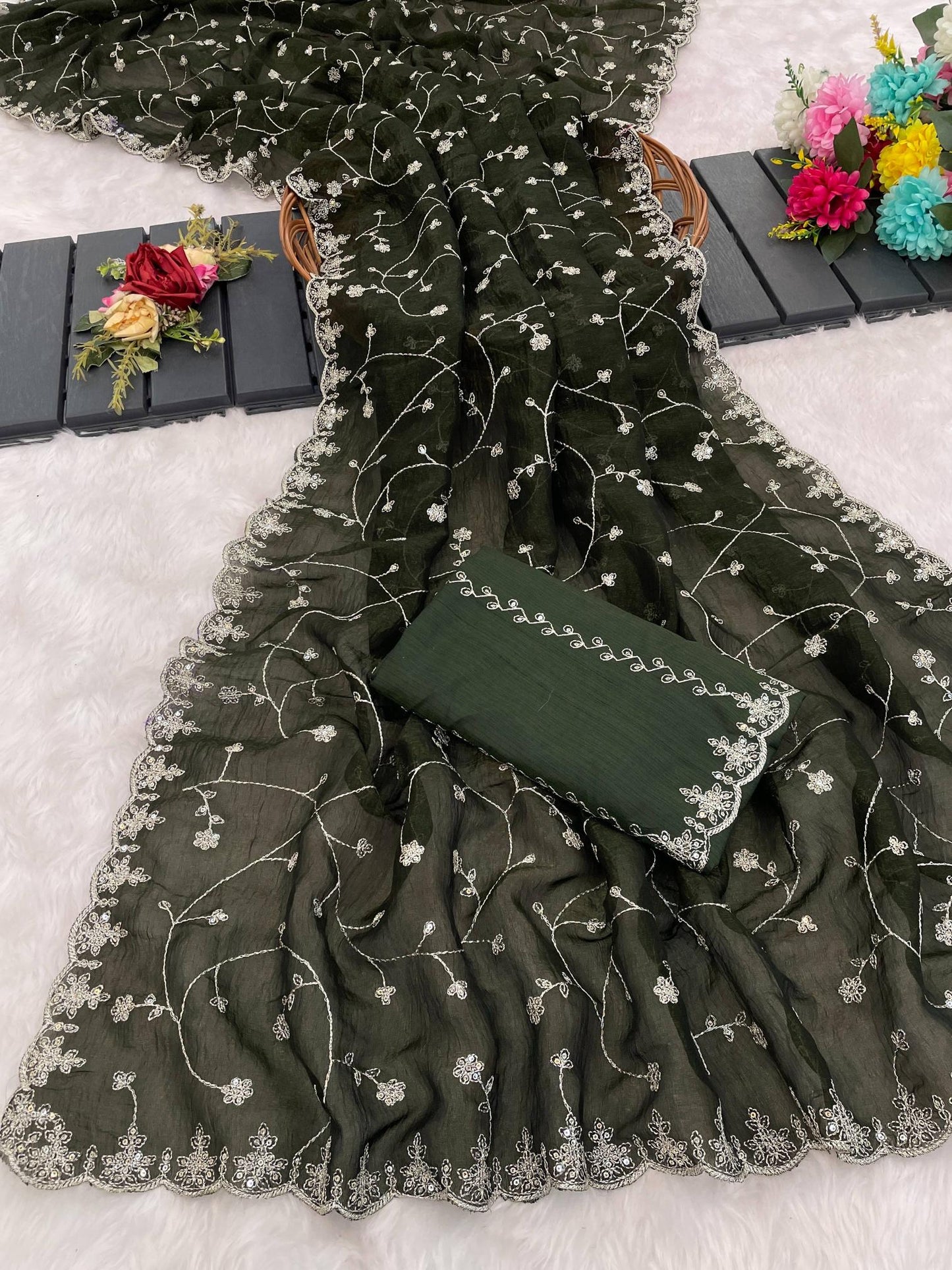 Dark green fabric with floral embroidery on a light gray background | Amrah Wholesale 6330 Modal Jimmy Choo Embroidered Saree Collection
