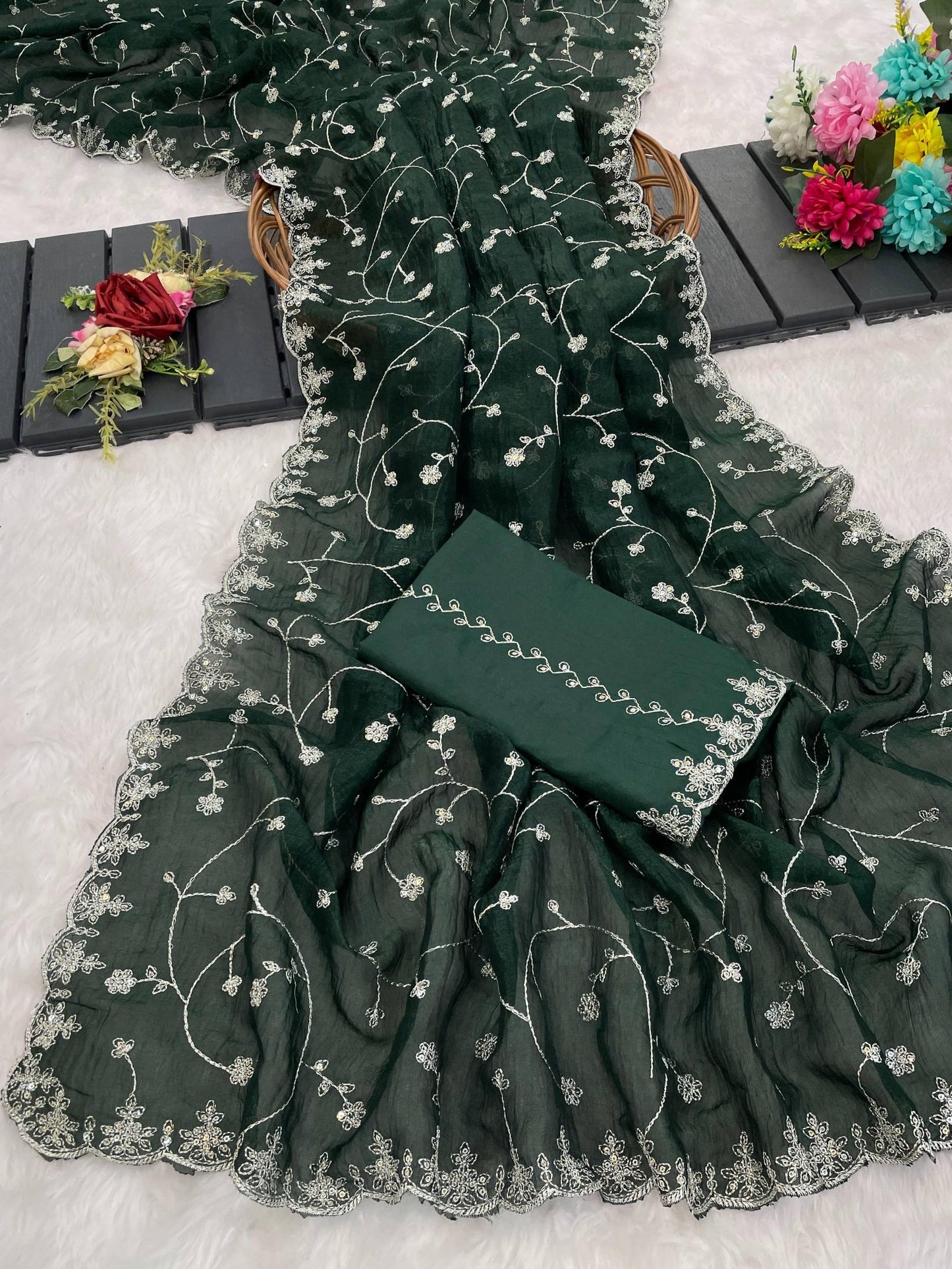Dark green embroidered fabric with a matching clutch on a light background | Amrah Wholesale 6330 Modal Jimmy Choo Embroidered Saree Collection