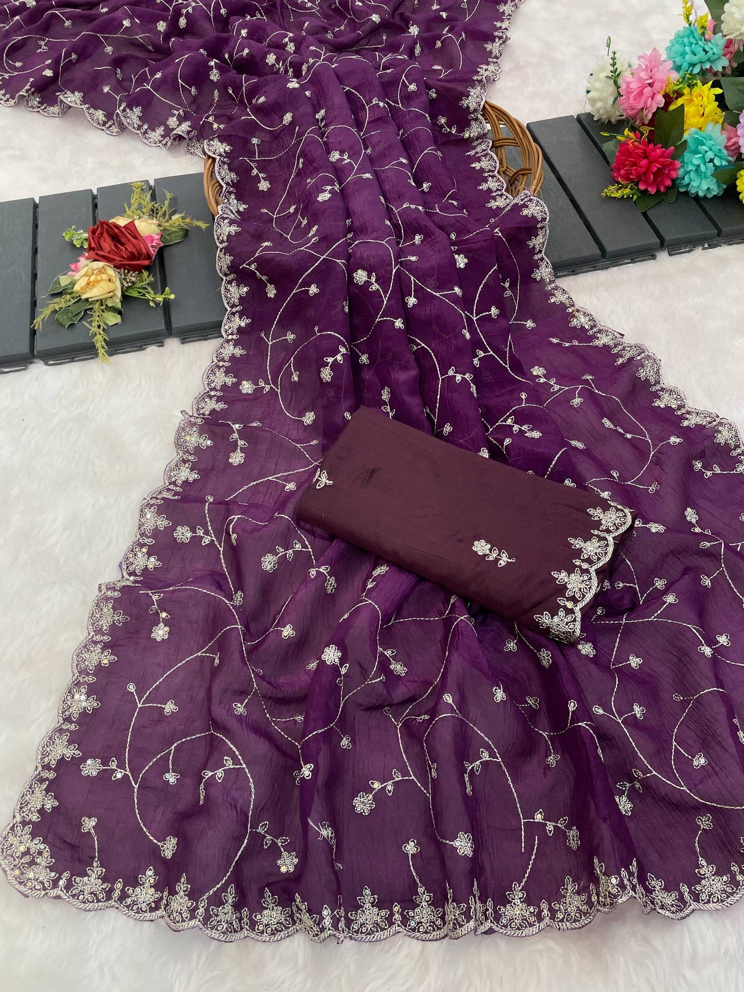 Purple embroidered fabric with a matching pouch on a light gray background | Amrah Wholesale 6330 Modal Jimmy Choo Embroidered Saree Collection