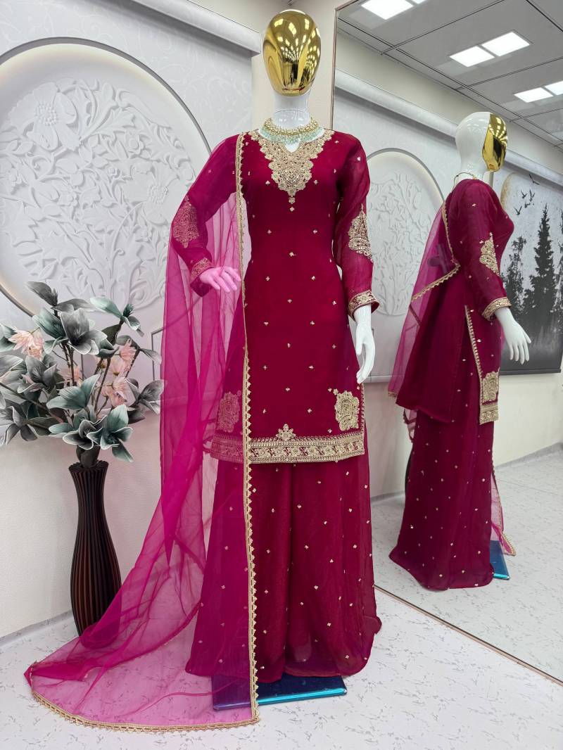 Maroon traditional outfit with gold embroidery on a mannequin in a well-lit room.  5002 Beautiful Fandy Satin Embroidery Worked Kurti With Bottom Dupatta