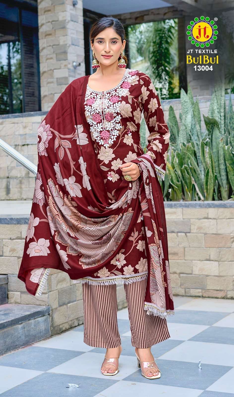 Jt Textile Bul Bul Vol-13 | Woman wearing a maroon floral outfit with a JT Textiles logo in the corner.