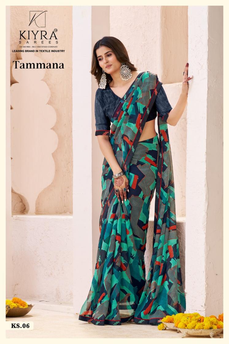 Woman wearing a colorful saree with a Kiyra label in the background | Kiyra Presents Tammana Georgette Fancy Sarees