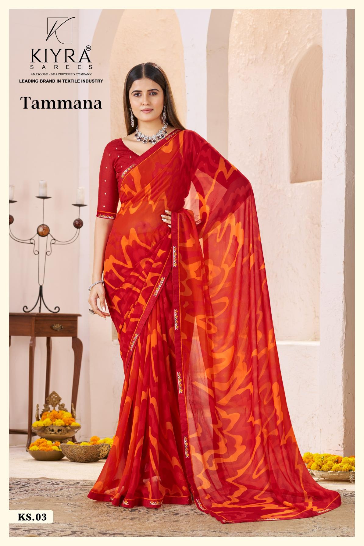 Woman wearing a red and orange saree with KIYRA SARVES branding. | Kiyra Presents Tammana Georgette Fancy Sarees