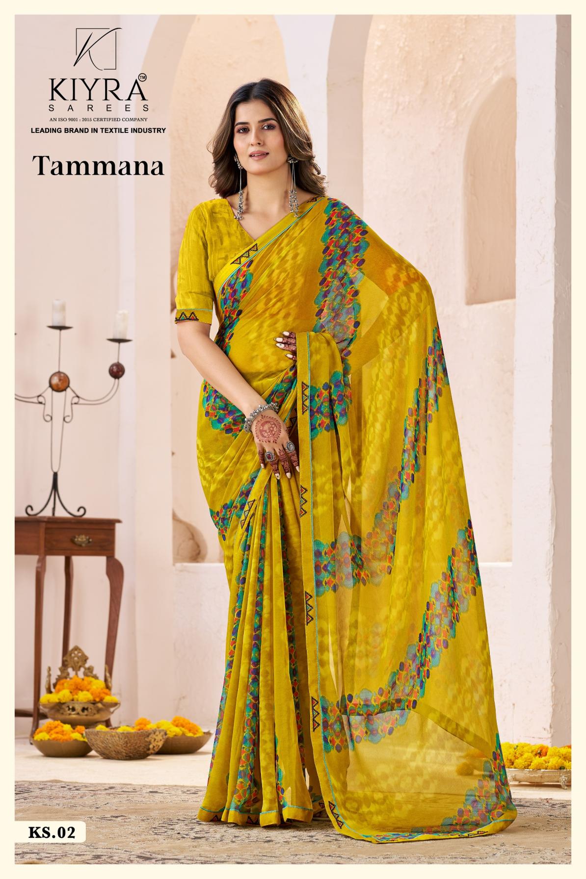 Woman wearing a yellow saree with floral patterns in an indoor setting | Kiyra Presents Tammana Georgette Fancy Sarees