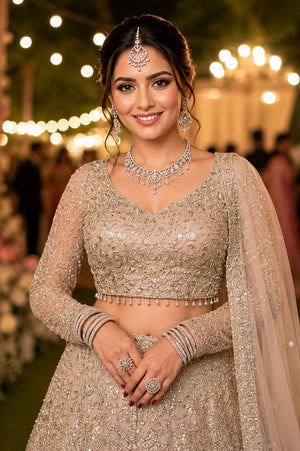 Mrudangi Griha Net With Beads Worked Lehenga Choli