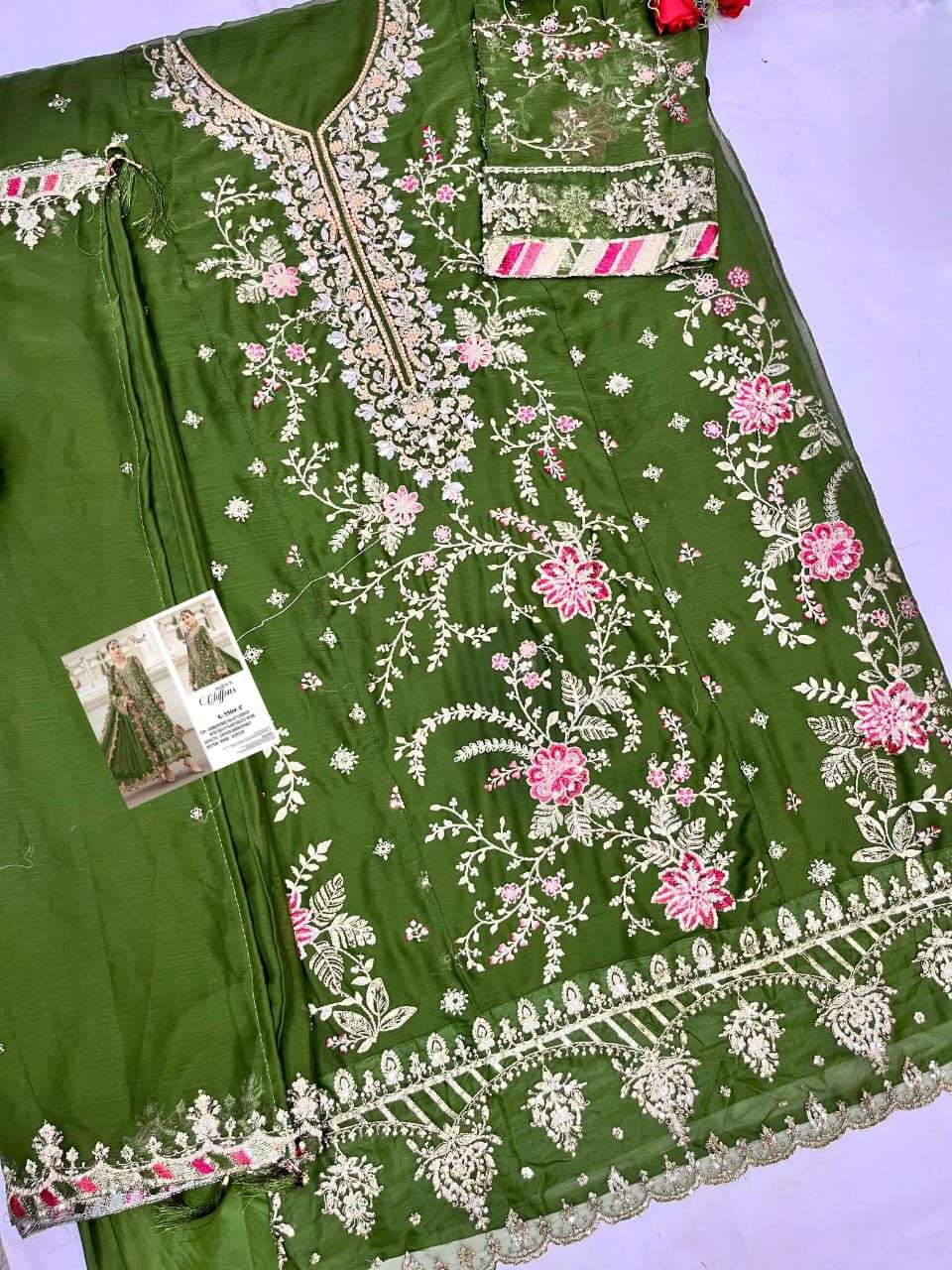 Green embroidered garment with floral patterns on a light purple background  | SHREE FAB K-5504 NX Pure Chiffon Embroidery Pakistani Dresses – Semi-Stitched Premium Collection