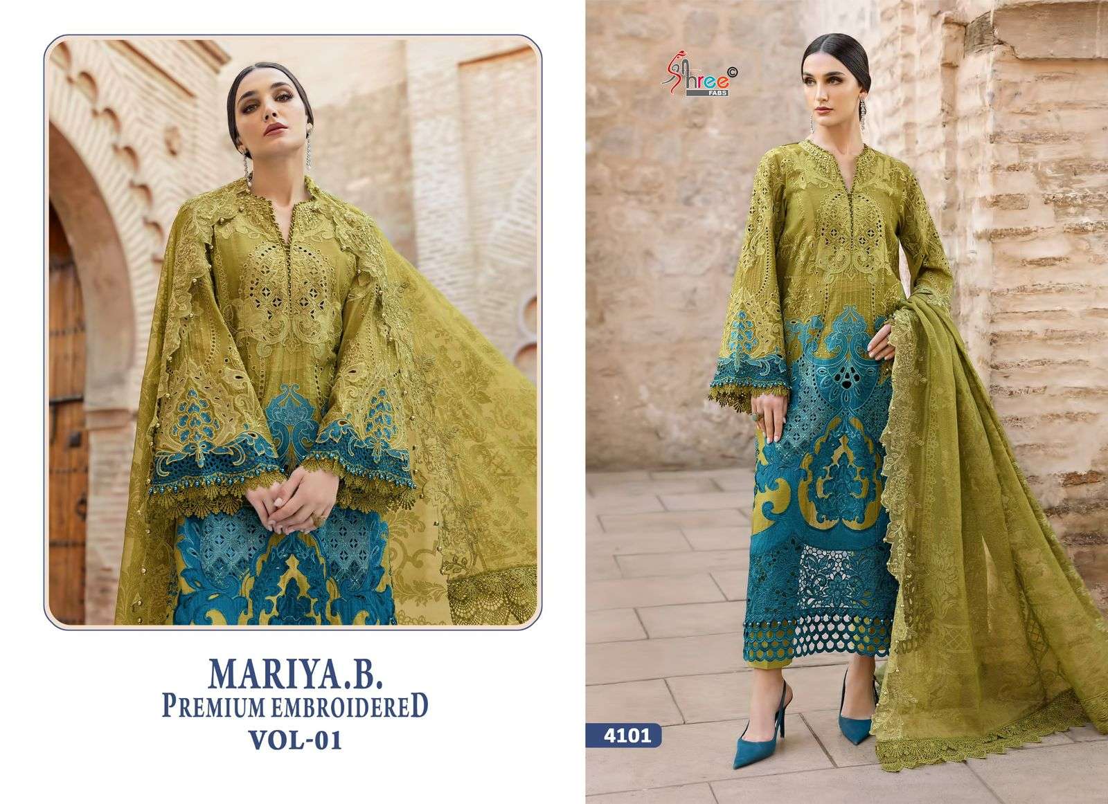 Woman wearing a green and blue embroidered outfit with a brick wall background | SHREE FAB MARIA B VOL-01 Pure Cotton Embroidered Pakistani Dresses Wholesale